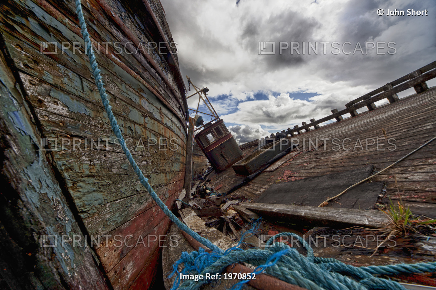 A Blue Rope Tied To An Old Weathered Wooden Boat On A Wooden Dock; Salem Isle ...