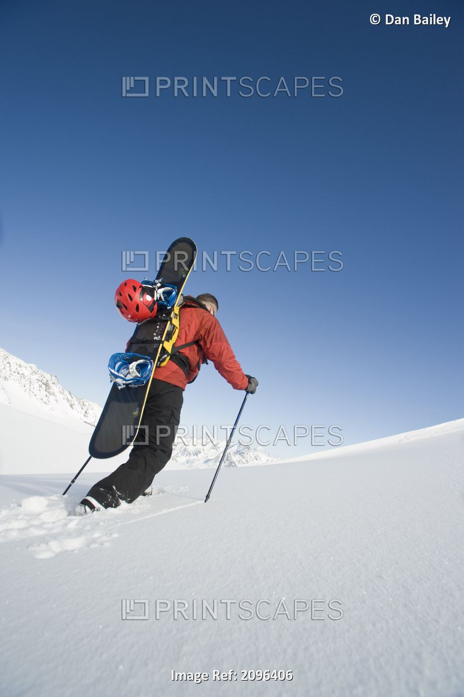 Man Backcountry Snowshoeing While Carrying A Snowboard On Eagle Glacier, ...