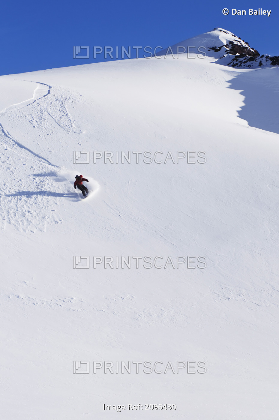 Backcountry Snowboarder Carving Turns Down A Steep Mountain Face, Eagle ...