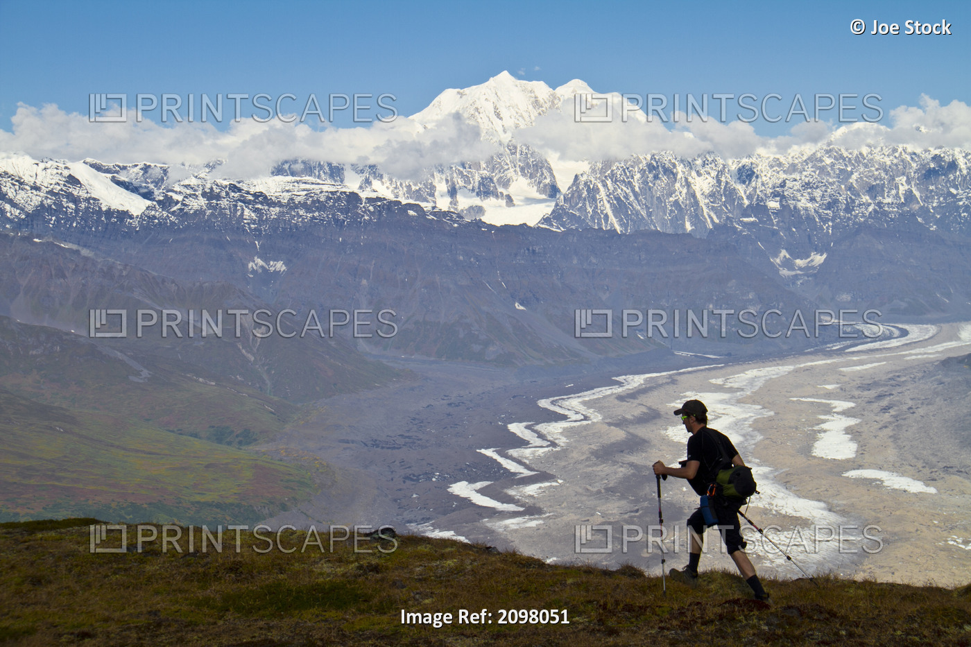 Silhouette Of A Man Hiking In The Tokosha Mountains Above The Tokositna Glacier ...