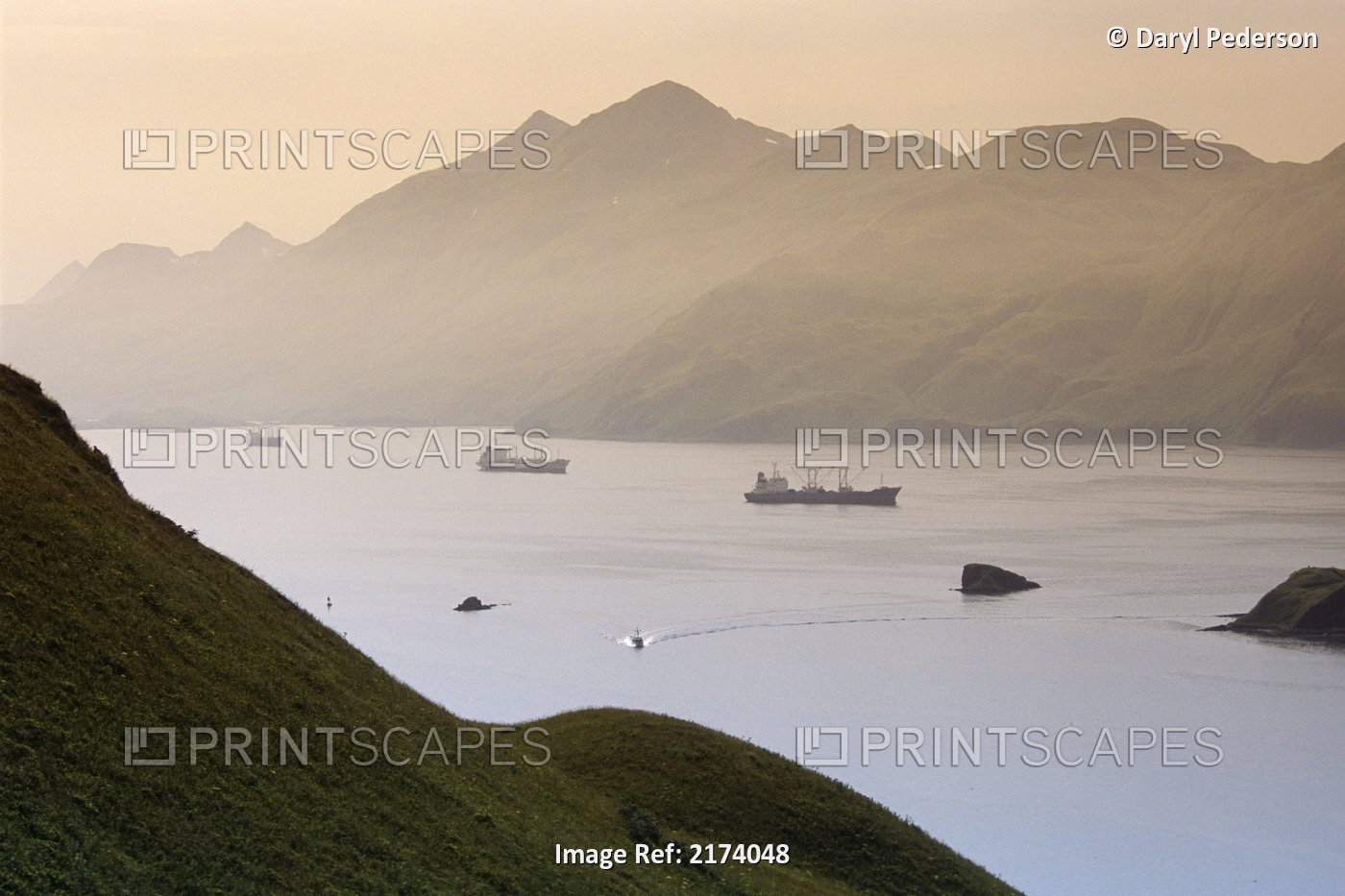 Commercial Ships Anchored In Captain's Bay At Sunset Unalaska Alaska Summer