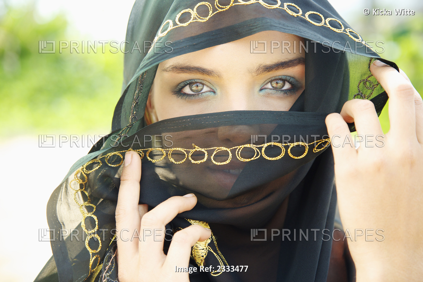 A Woman's Eyes Peering Out From A Headscarf; Kauai, Hawaii, United States Of ...