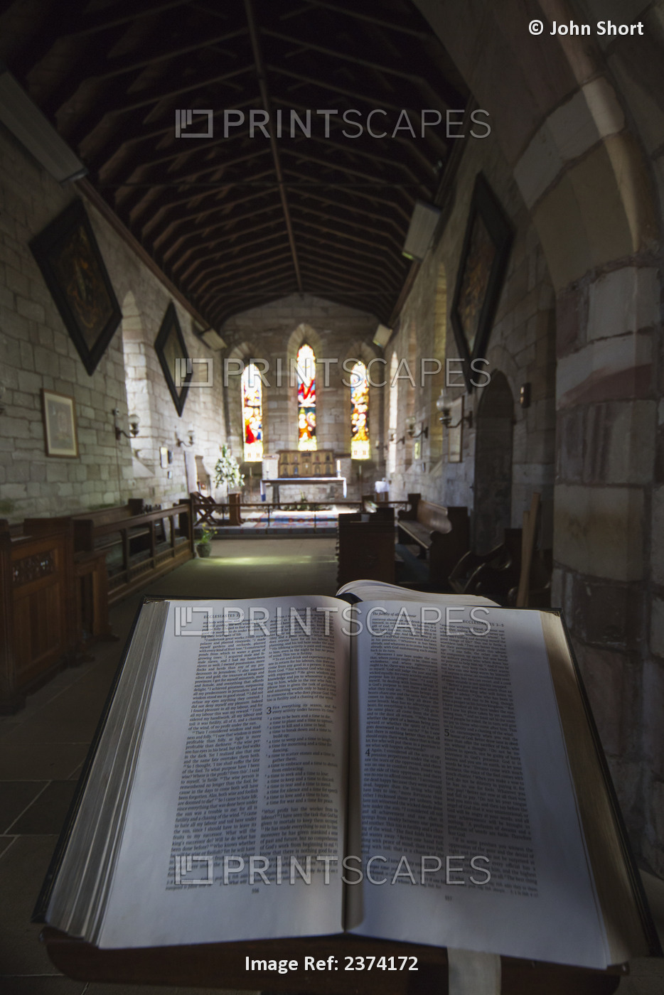 View Of The Interior Of A Church With Stained Glass Windows And An Open Bible; ...