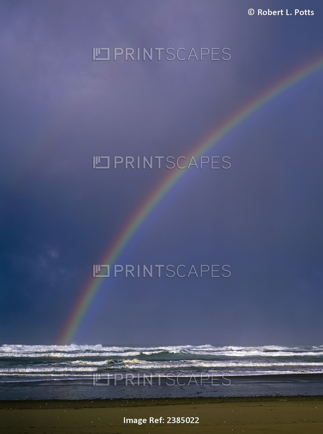 A Rainbows Arcs Over The Surf; Winchester Bay, Oregon, United States Of America