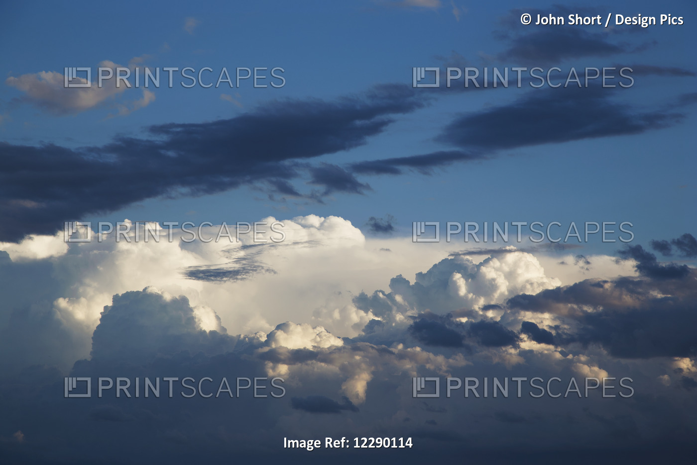 White And Dark Clouds In A Blue Sky; Kings Beach, Queensland, Australia