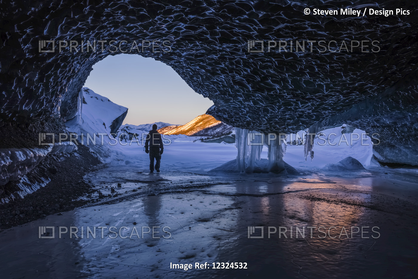 A Man Walks Out The Entrance Of An Ice Tunnel At The Terminus Of Canwell ...
