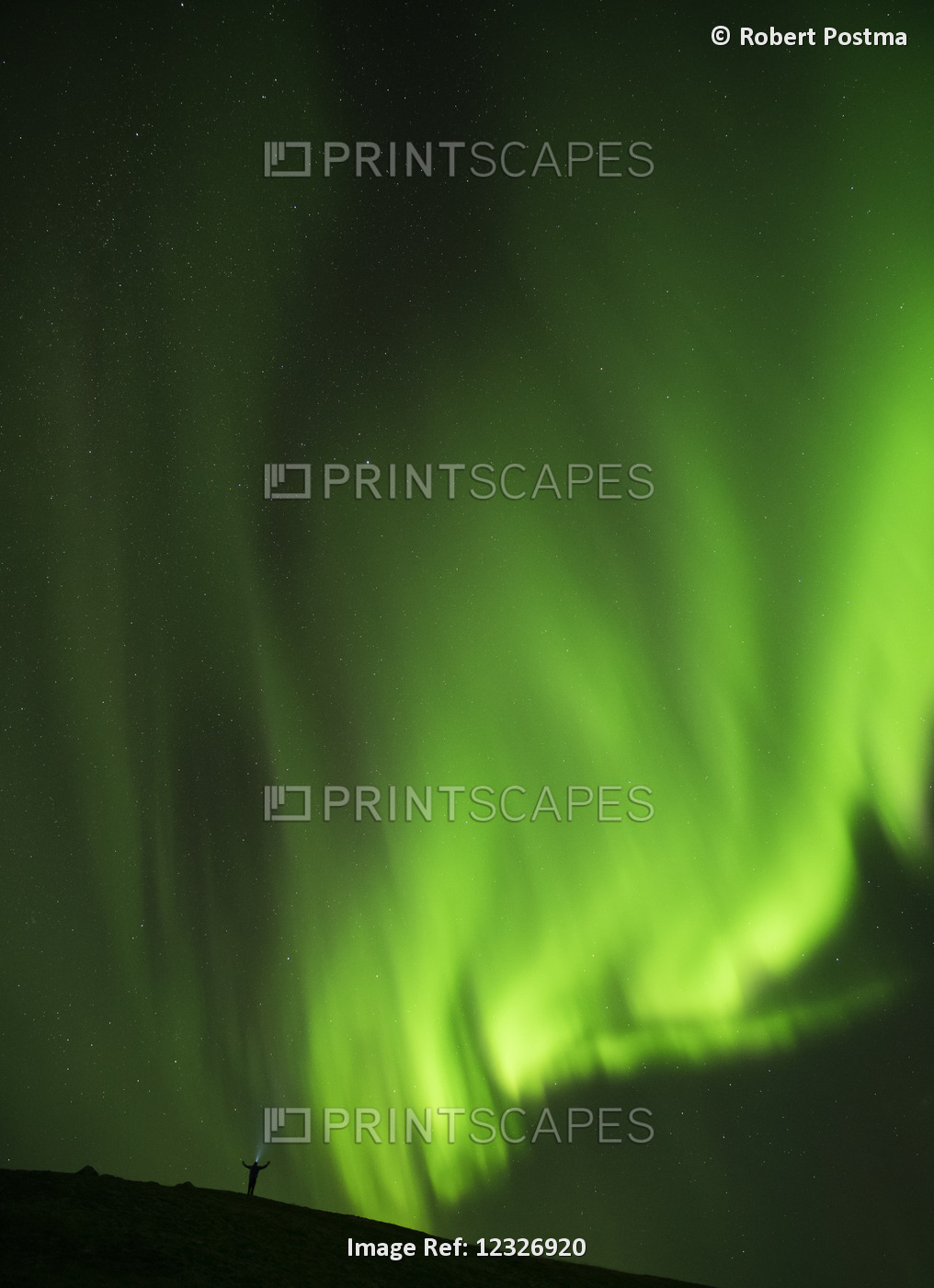 Man Standing Under The Northern Lights With His Arms Outstretched And A Head ...