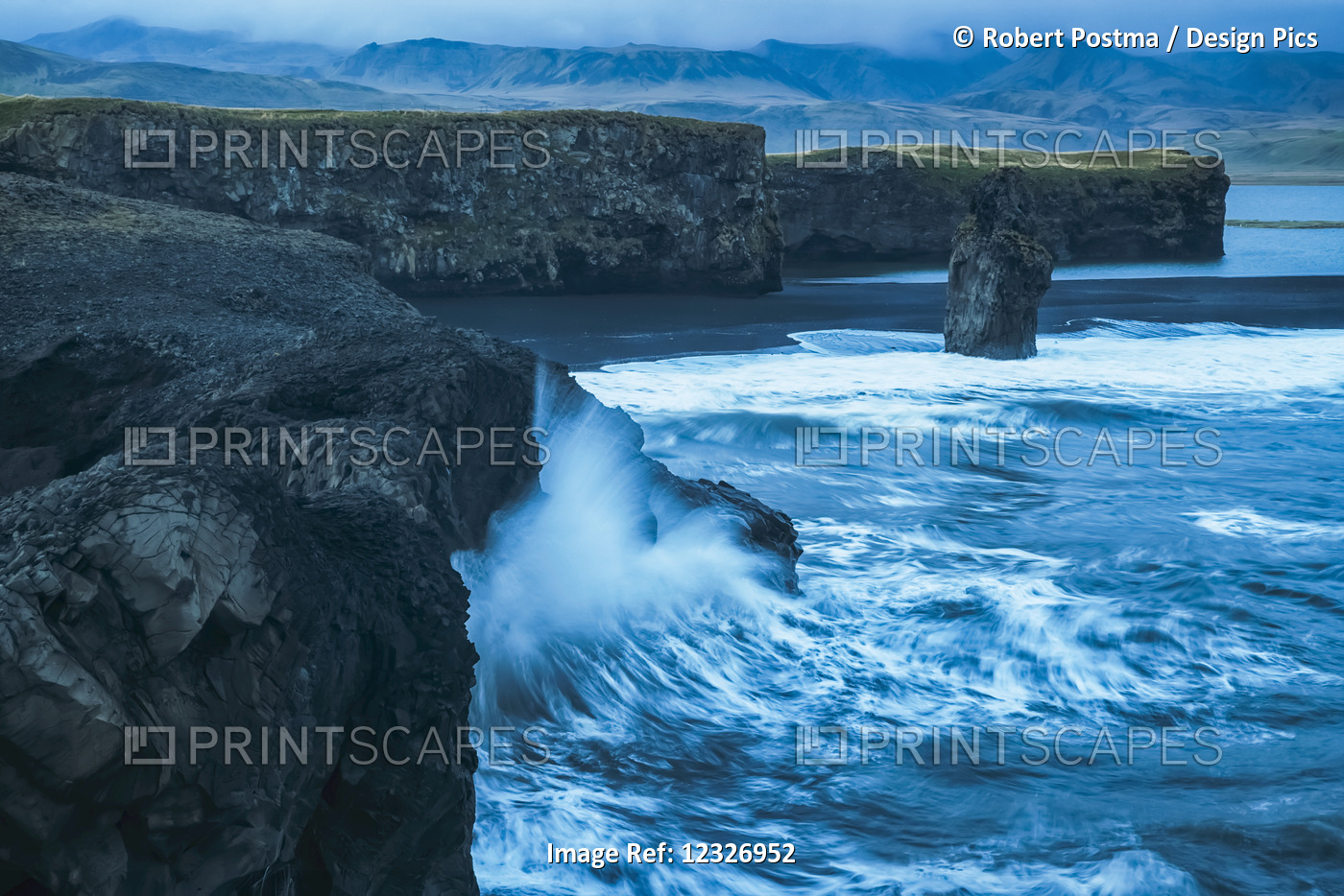 Large Waves Splash Against The Cliff Sides Of Dryholaey, Southern Iceland; ...