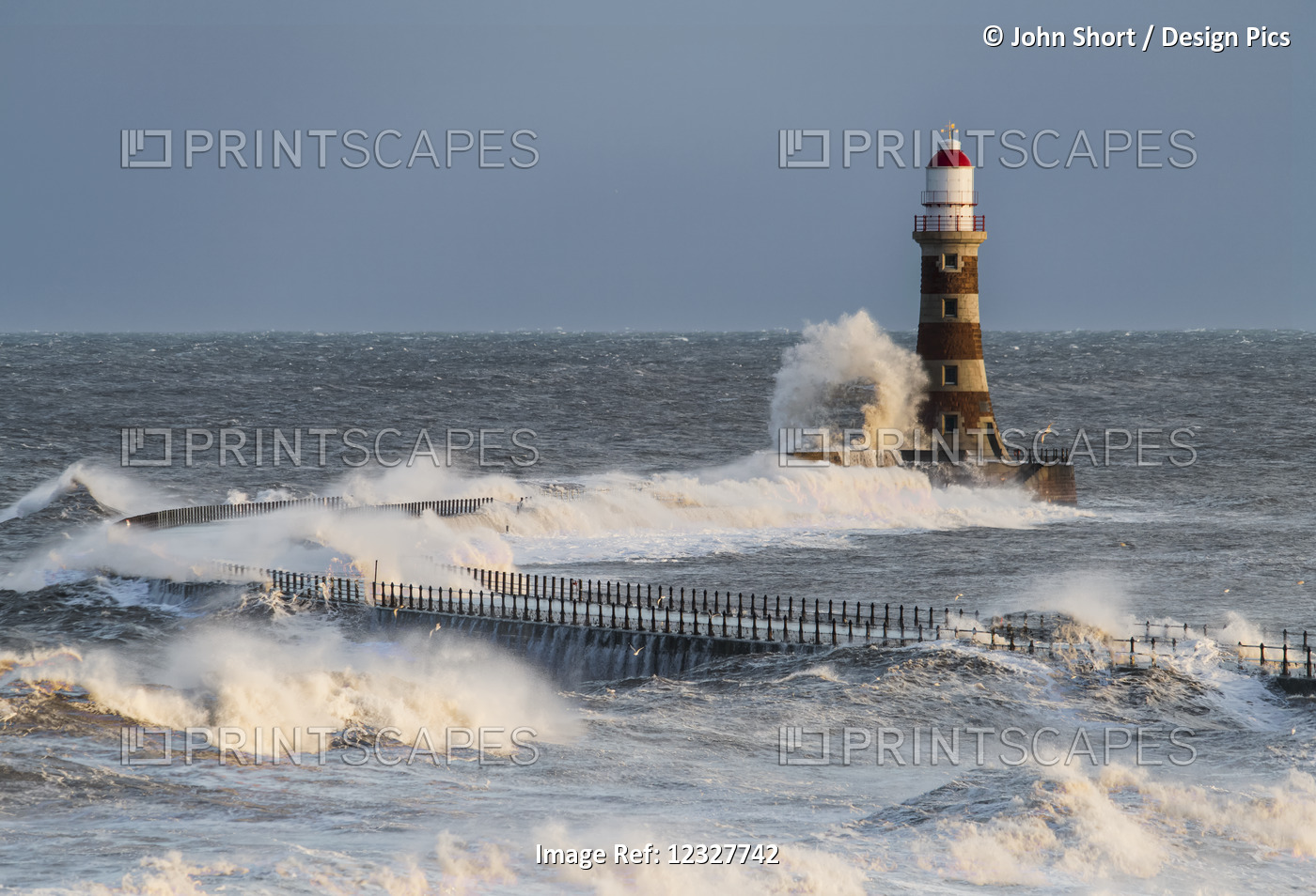 Waves Splashing Against Roker Lighthouse At The End Of A Pier; Sunderland, Tyne ...