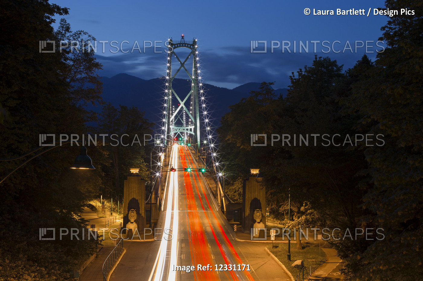 Long Exposure Twilight Image Of The Lions Gate Bridge With Car Headlights ...