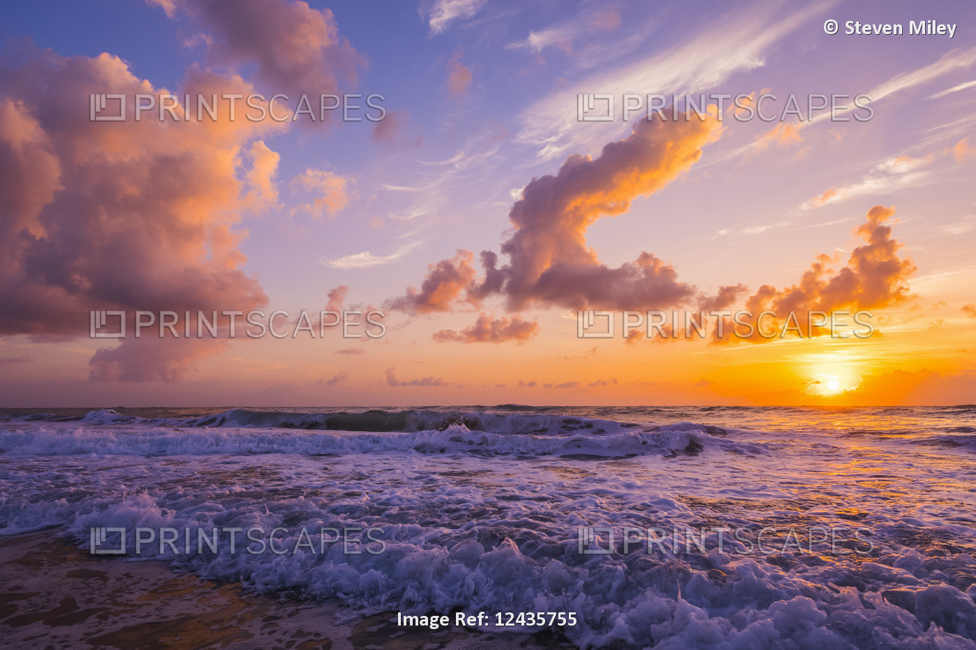 Sunrise over the Atlantic Ocean with the surf washing up on the shore; ...