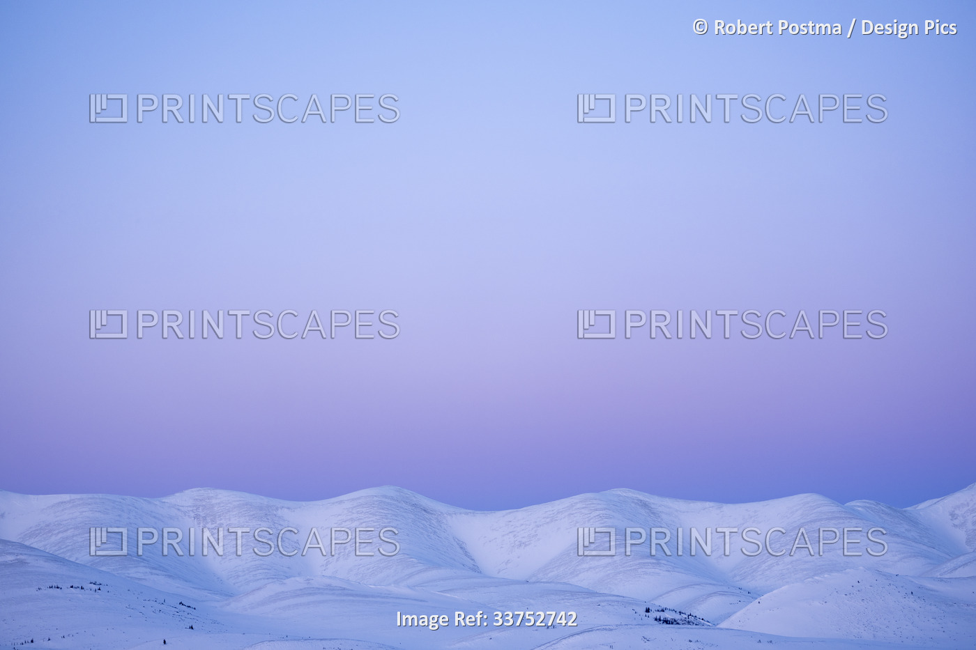 Alpenglow light at the Arctic Circle in northern Yukon, creating a stunning ...