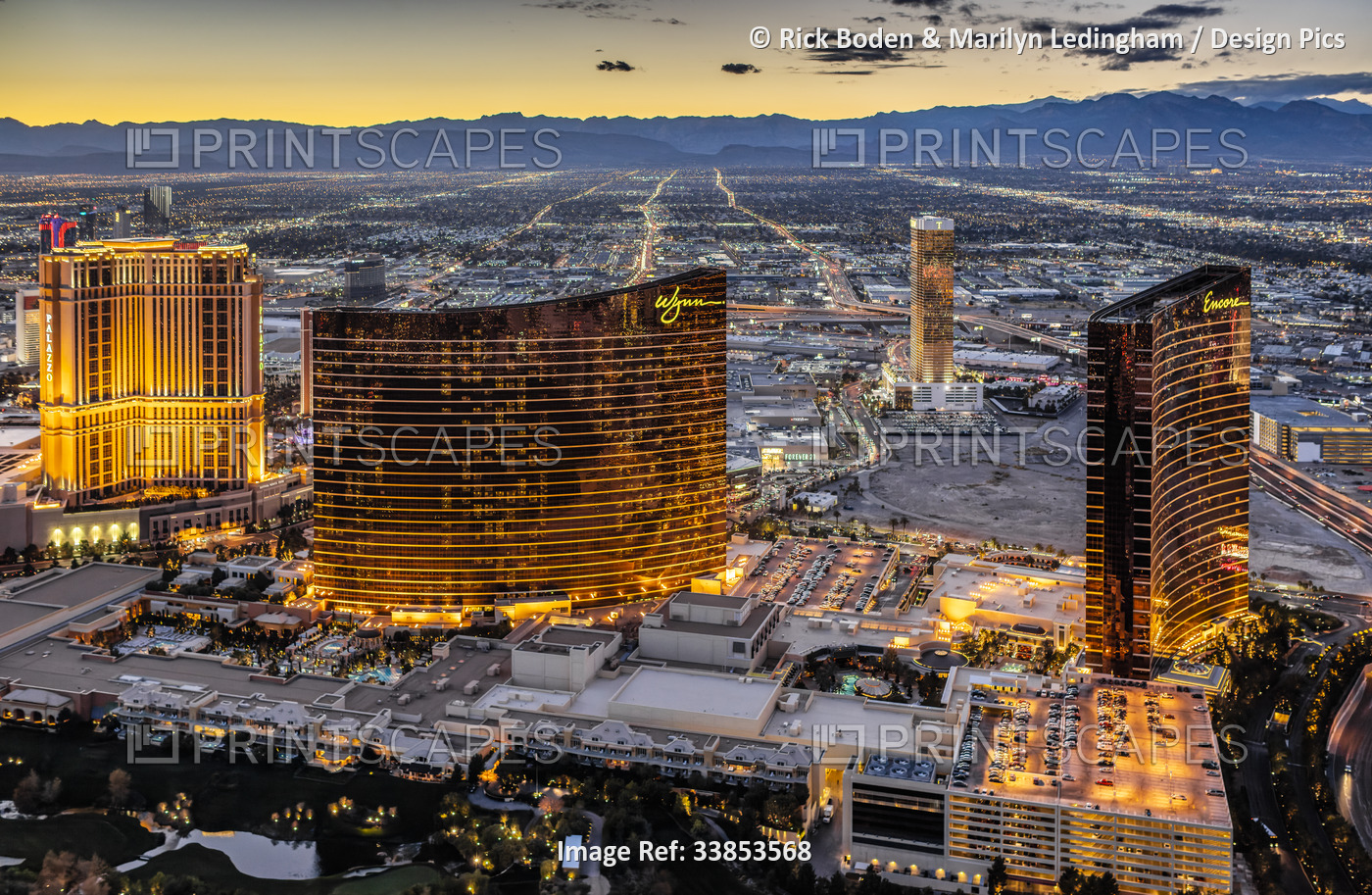 Sunset aerial photo of the strip in Las Vegas with featuring landmark hotels; ...