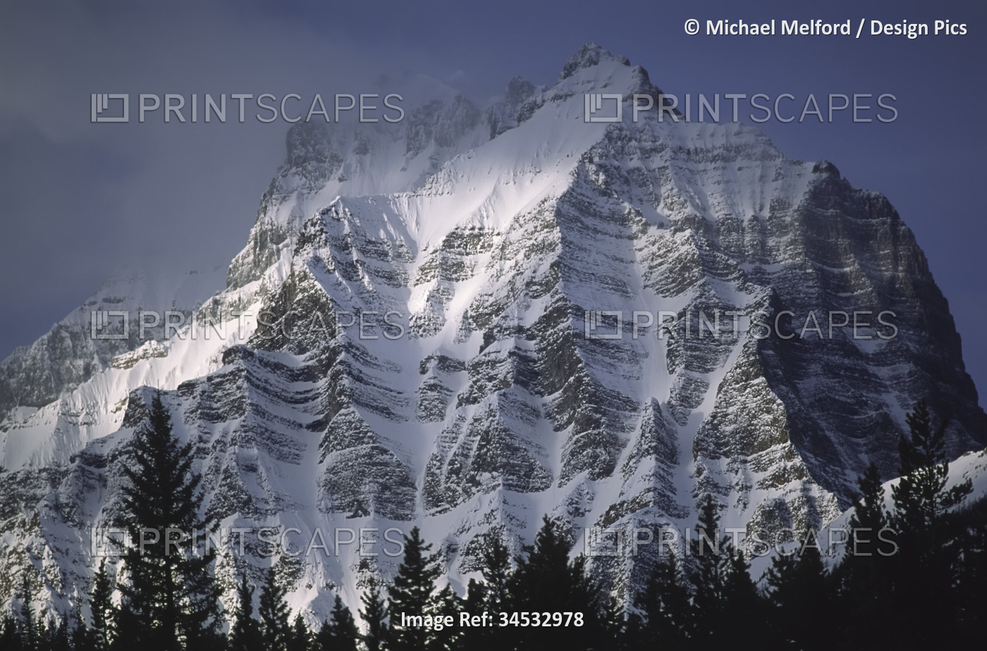 Rugged snow-covered mountain in Banff National Park, Alberta, Canada; Alberta, ...